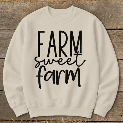 Cream sweatshirt with "FARM sweet farm" text in black lettering.