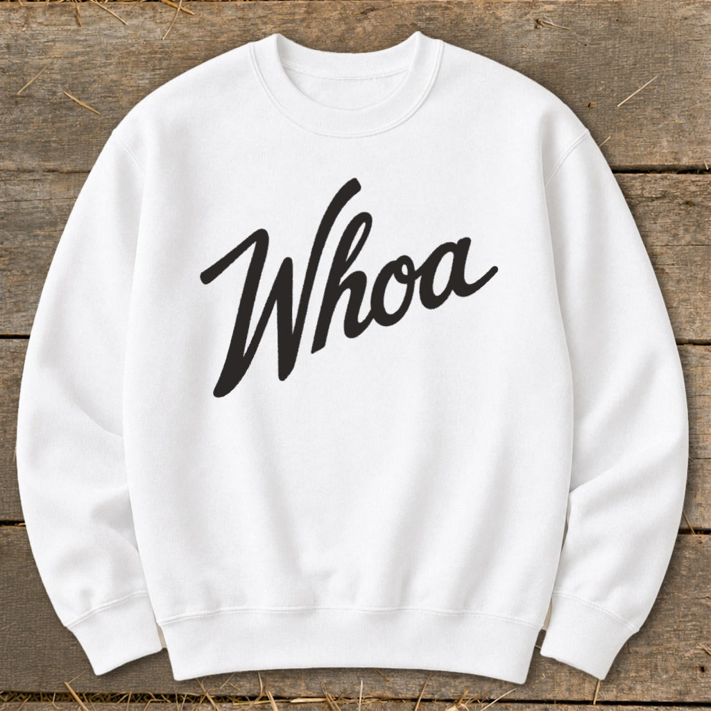 White sweatshirt with "Whoa" written in black cursive font.