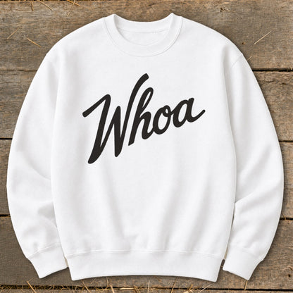 White sweatshirt with "Whoa" written in black cursive font.