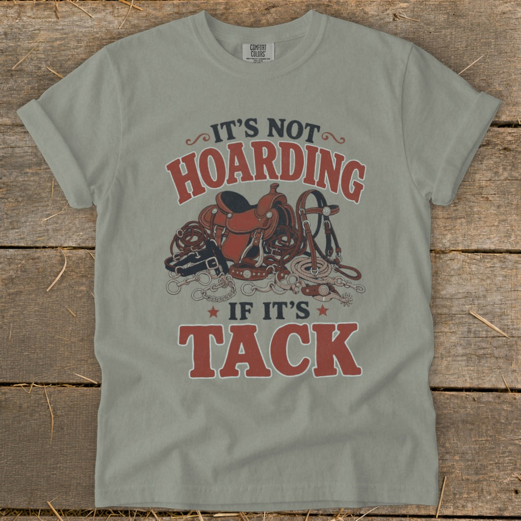 T-shirt with "It's not hoarding if it's tack" text and horse tack illustration.