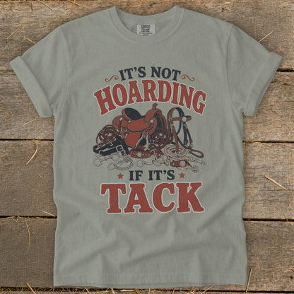 T-shirt with "It's not hoarding if it's tack" text and horse tack illustration.