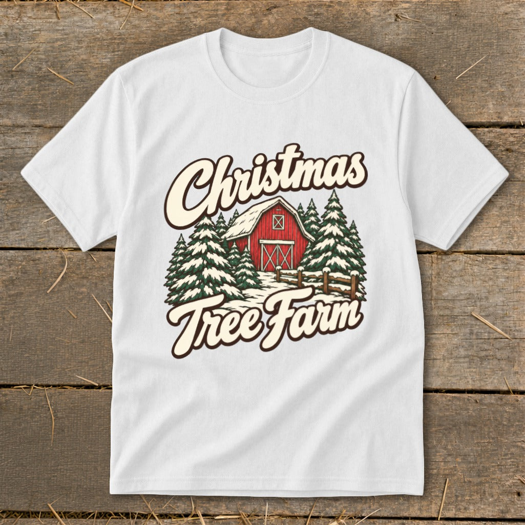 White t-shirt with "Christmas Tree Farm" text and a red barn with snow-covered trees.
