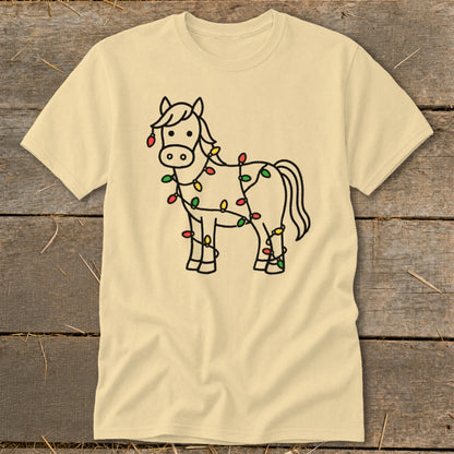 Light beige t-shirt with a black outline drawing of a horse wrapped in Christmas lights.