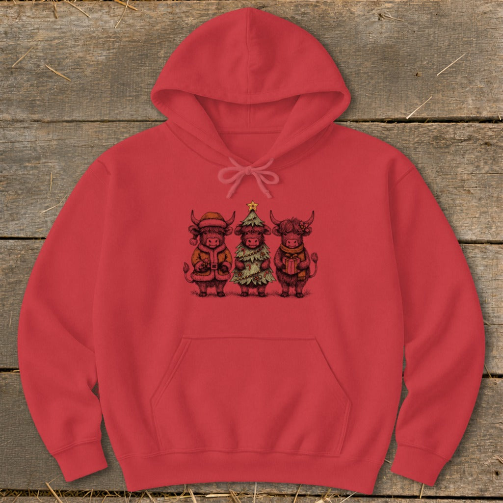 Red hoodie with a graphic of three Highland cows in festive holiday attire.