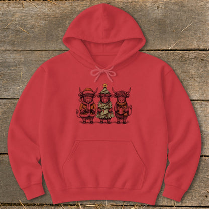 Red hoodie with a graphic of three Highland cows in festive holiday attire.