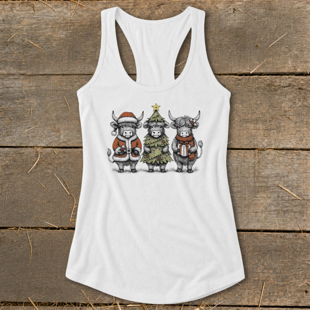 White tank top with sketch of three Highland cows in festive Christmas attire.