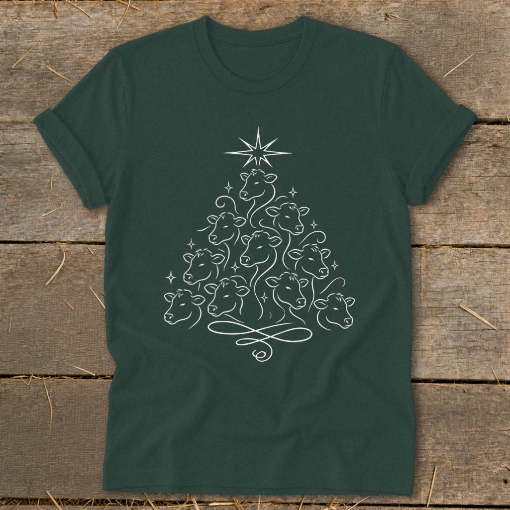 Dark green t-shirt with a white line drawing of cows arranged in a Christmas tree shape.