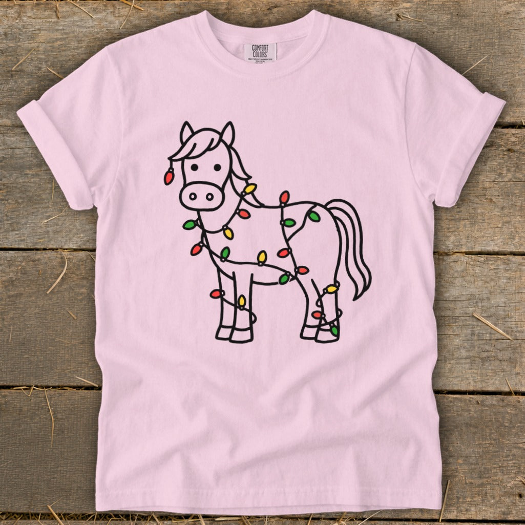Pink t-shirt with a black line drawing of a horse covered in colorful Christmas lights.