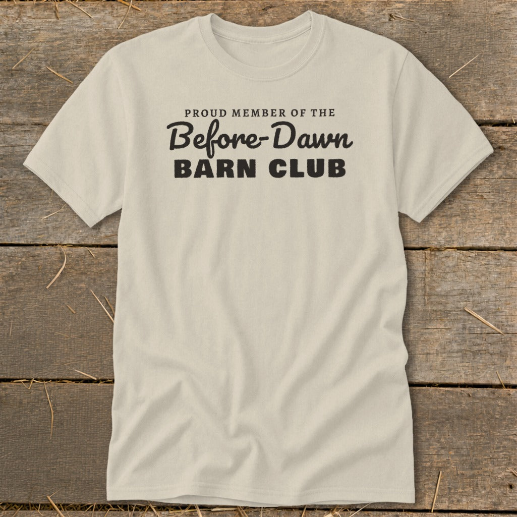 Light-colored t-shirt with black text that reads "Proud Member of the Before-Dawn Barn Club."