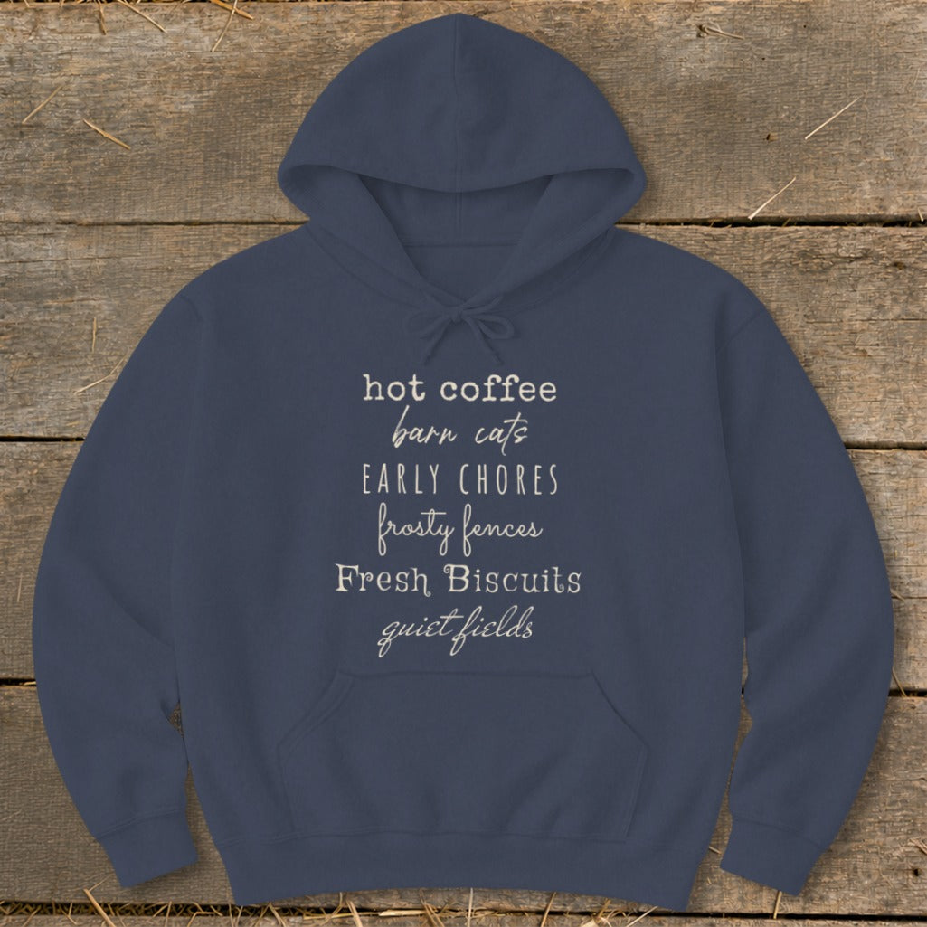 Navy hoodie with text: "hot coffee, barn cats, early chores, frosty fences, Fresh Biscuits, quiet fields."