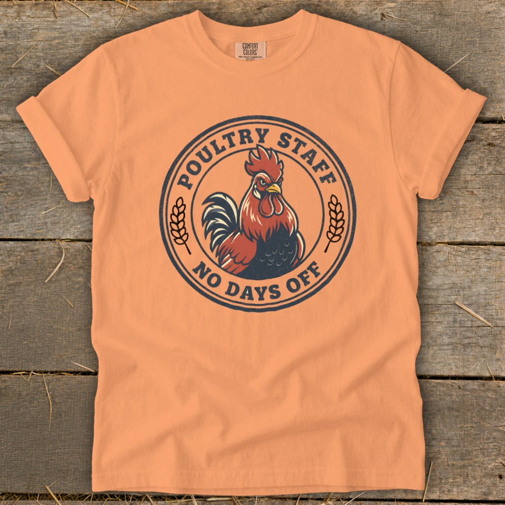 Orange t-shirt with round graphic of a rooster and text "Poultry Staff No Days Off".