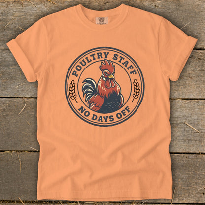 Orange t-shirt with round graphic of a rooster and text "Poultry Staff No Days Off".