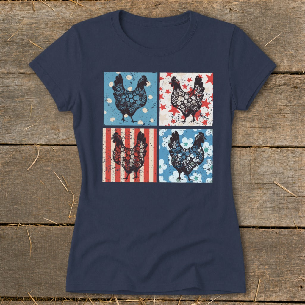 Four patterned chickens on a navy blue t-shirt against a wood background.