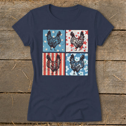 Four patterned chickens on a navy blue t-shirt against a wood background.