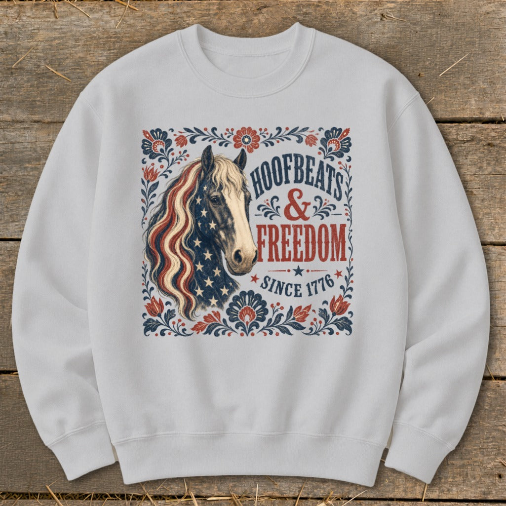 White sweatshirt featuring a horse with an American flag mane and "Hoofbeats & Freedom Since 1776" text.
