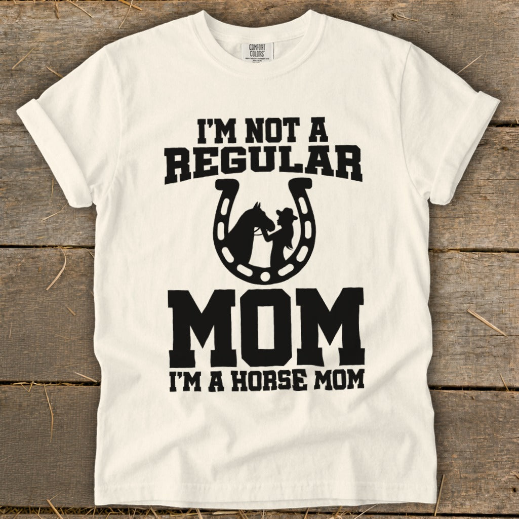 White t-shirt with black text: "I'M NOT A REGULAR MOM I'M A HORSE MOM".