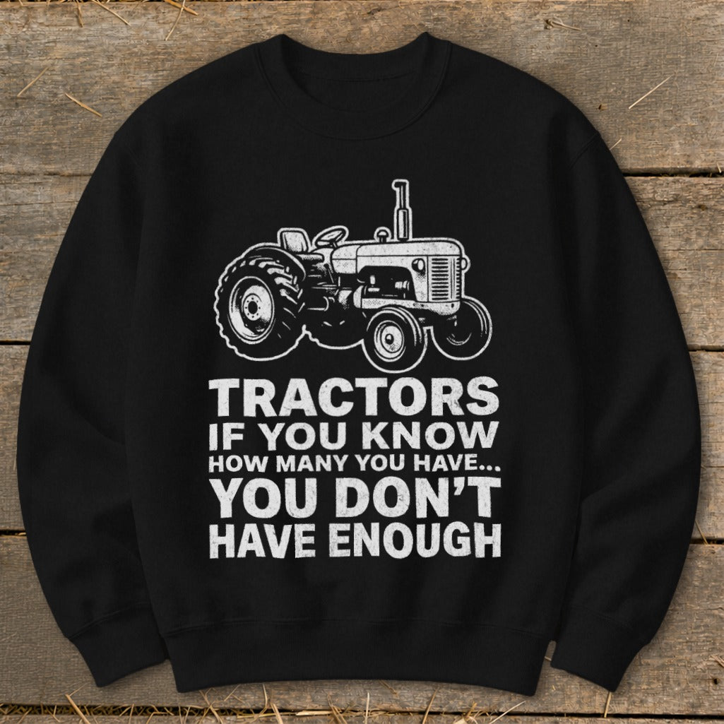 Black sweatshirt with a tractor graphic and text reading "Tractors If You Know How Many You Have... You Don't Have Enough".