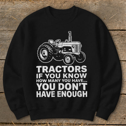 Black sweatshirt with a tractor graphic and text reading "Tractors If You Know How Many You Have... You Don't Have Enough".