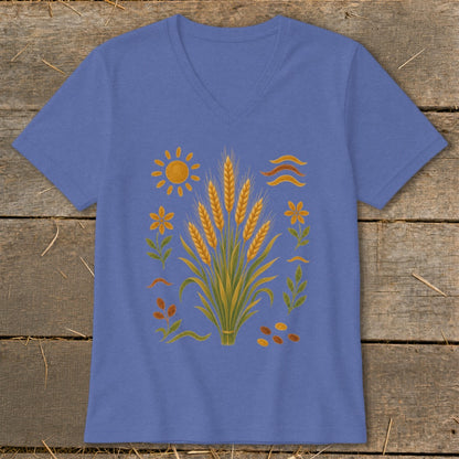 Blue v-neck t-shirt with wheat, sun, flowers, and wavy lines graphic.