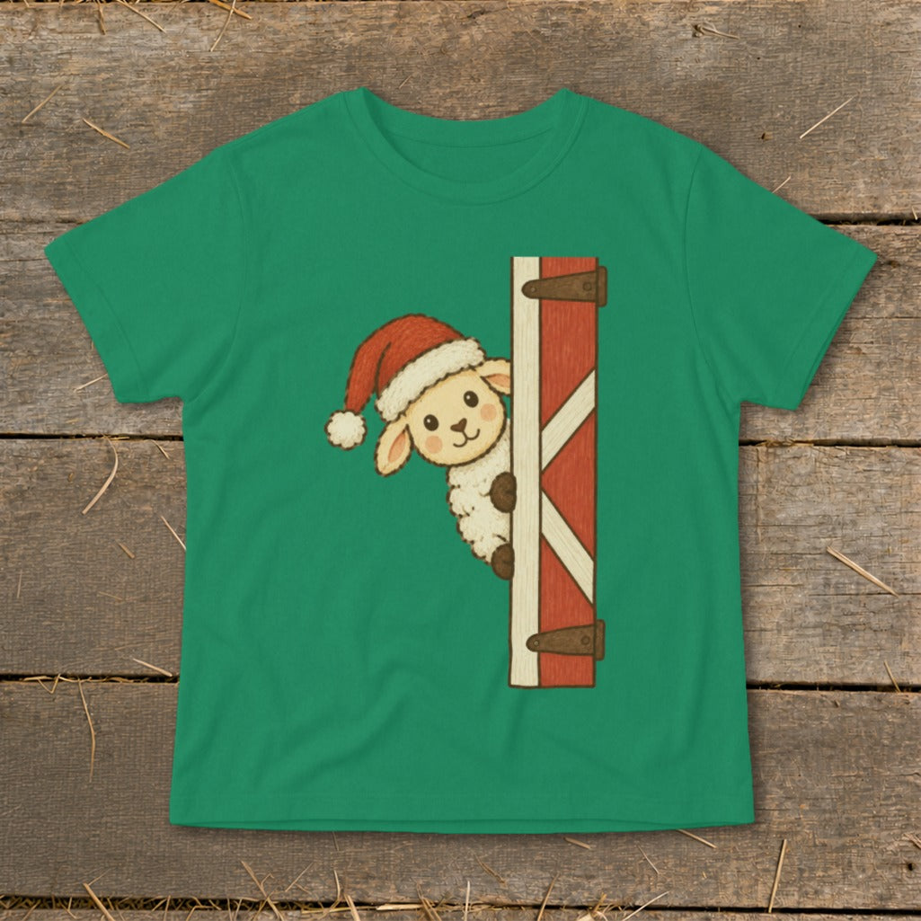 Green t-shirt featuring a cartoon sheep wearing a Santa hat peeking from behind a barn door.