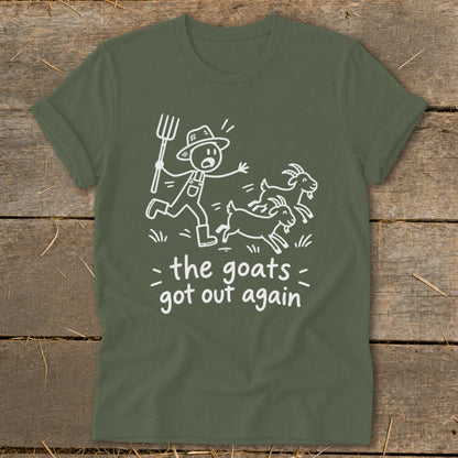 Green t-shirt with white cartoon of farmer chasing goats with text "the goats got out again".