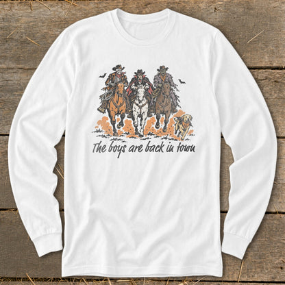 Three spooky characters on horseback with a dog, text "The boys are back in town".