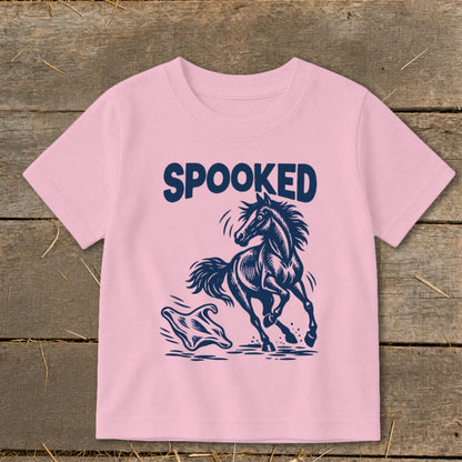 Pink t-shirt with dark blue "SPOOKED" text and a startled horse and ghost graphic.