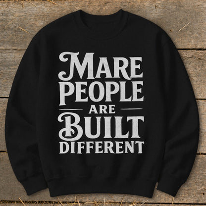 Black sweatshirt with white text reading "Mare People Are Built Different."