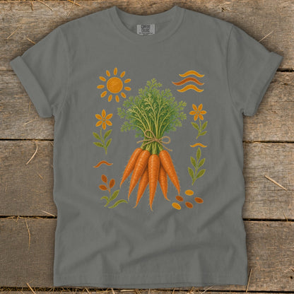 Grey t-shirt with a graphic of carrots, sun, flowers, and leaves.