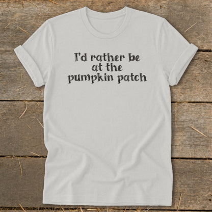 White t-shirt with black text that reads "I'd rather be at the pumpkin patch".