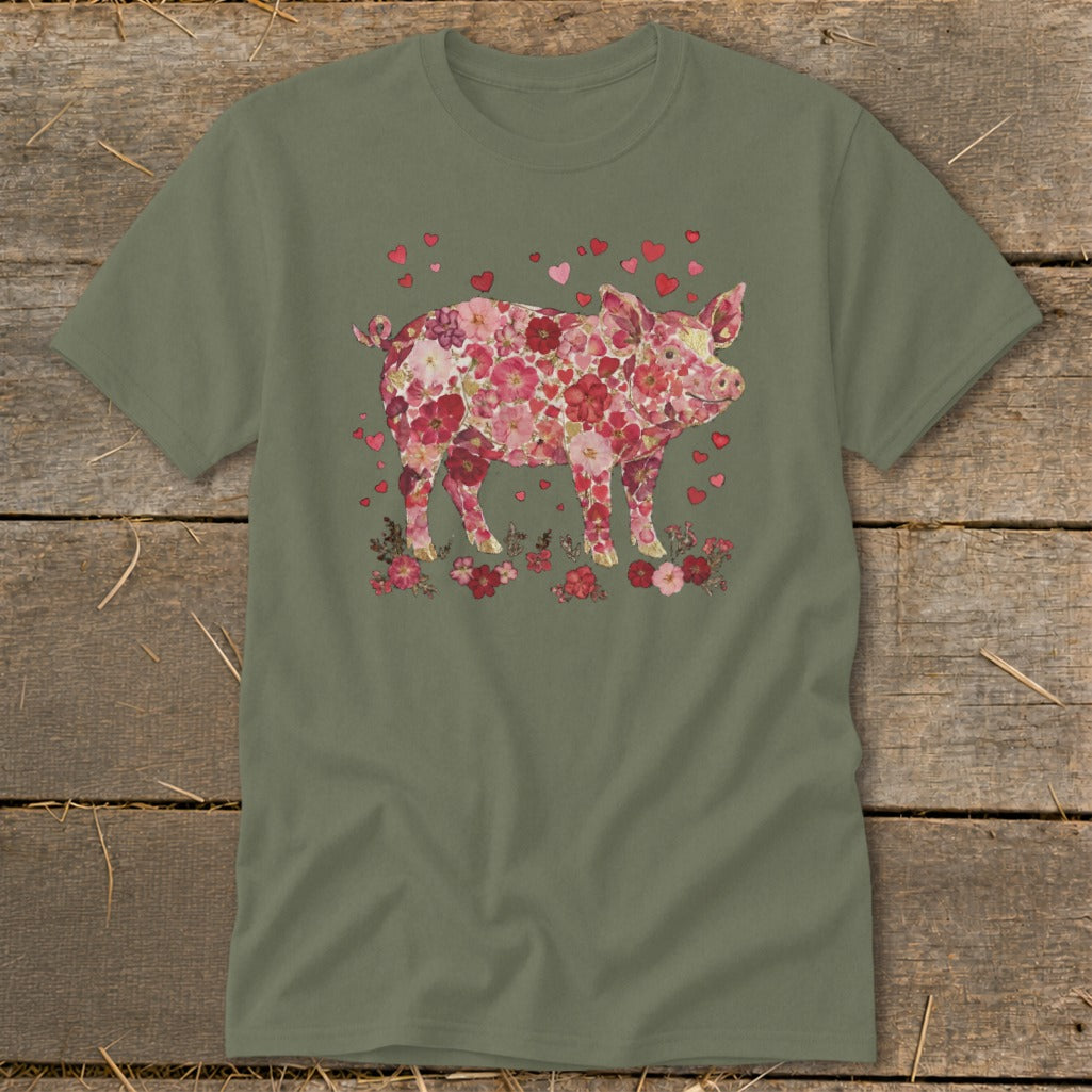 Green t-shirt with a pink floral pig and red hearts design.