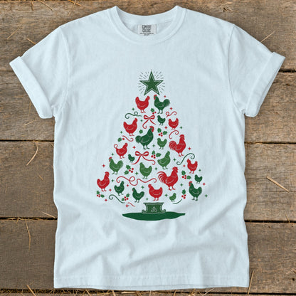 White t-shirt with a Christmas tree made of red and green chickens and holly.