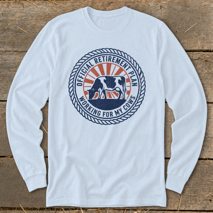White long-sleeve shirt with a circular graphic featuring a cow and text about retirement.