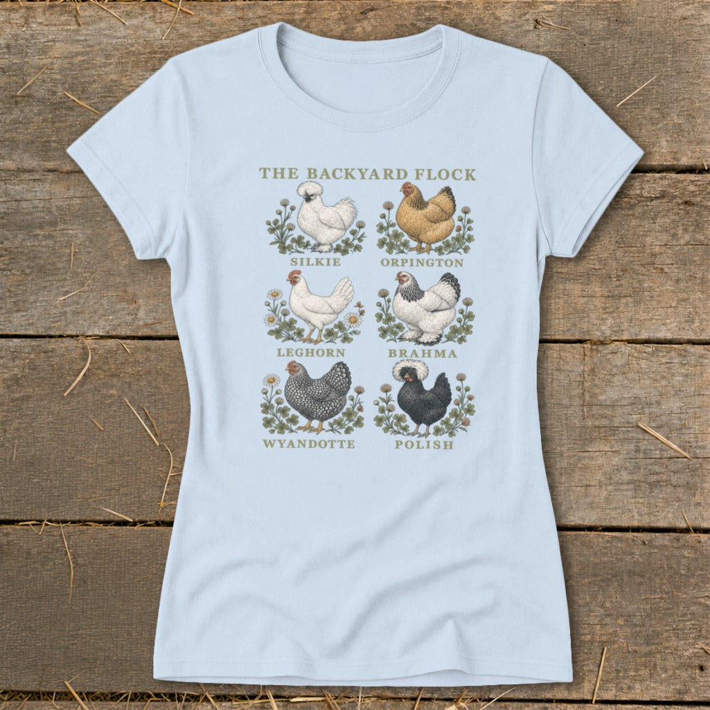 Light blue t-shirt with illustrations of six chicken breeds: Silkie, Orpington, Leghorn, Brahma, Wyandotte, and Polish.