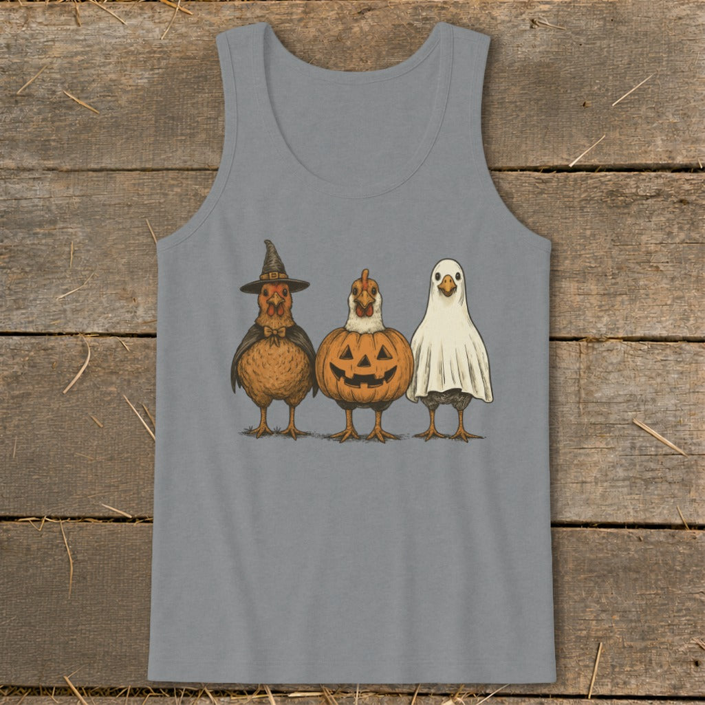 Three chickens dressed for Halloween: one as a witch, one as a pumpkin, and one as a ghost.