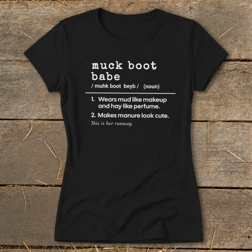 Black t-shirt with "muck boot babe" definition: wears mud like makeup and makes manure look cute.