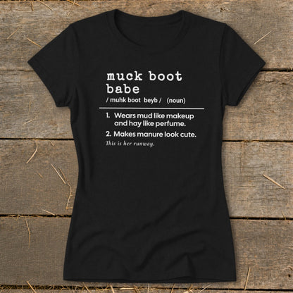 Black t-shirt with "muck boot babe" definition: wears mud like makeup and makes manure look cute.