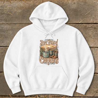 White hoodie with "But First, Chores" graphic featuring coffee, boots, and farm elements.