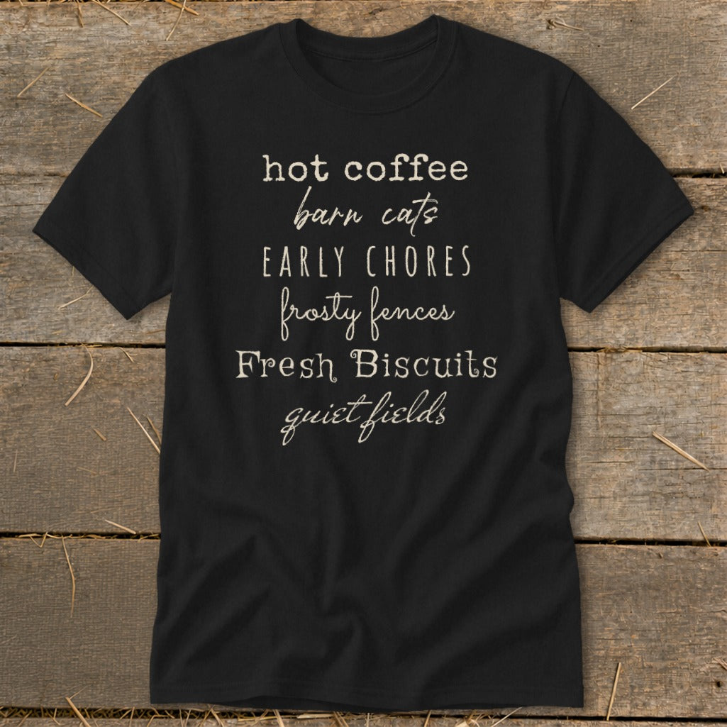 Black t-shirt with "hot coffee barn cats EARLY CHORES frosty fences Fresh Biscuits quiet fields" text.