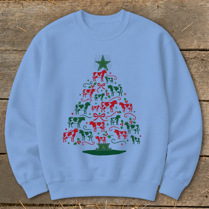 Light blue sweatshirt with a Christmas tree made of red and green cows.