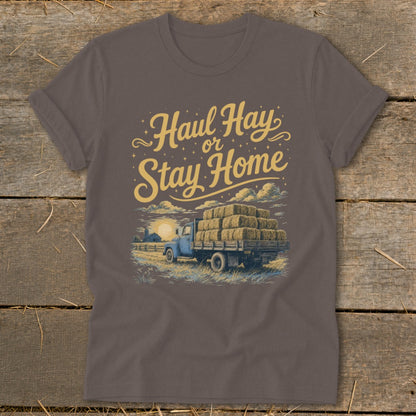 T-shirt graphic with "Haul Hay or Stay Home" text and vintage truck loaded with hay.