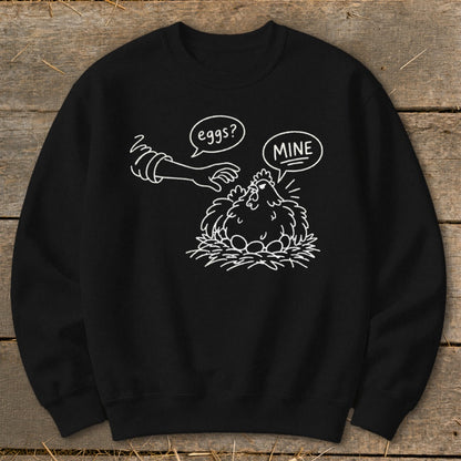 Black sweatshirt with white line drawing of a chicken on a nest of eggs.