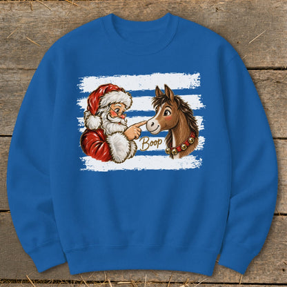 Santa Claus booping a horse with the word "Boop" on a blue sweatshirt.
