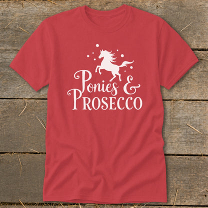 Red t-shirt with white graphic of a horse and text "Ponies & PROSECCO".