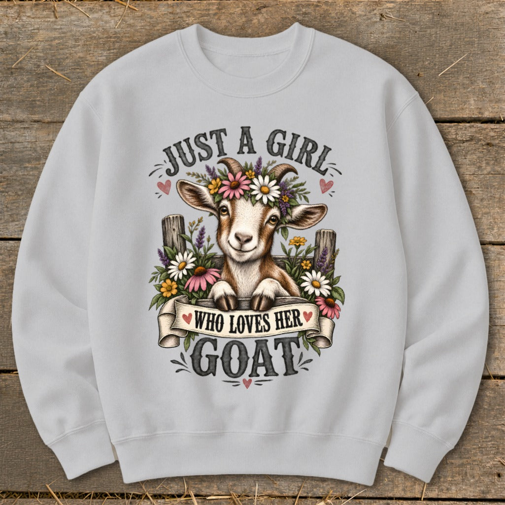 Light grey sweatshirt with a happy goat wearing a flower crown and text "Just a girl who loves her goat".