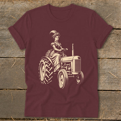 Woman in vintage dress driving a tractor, cream illustration on burgundy shirt.