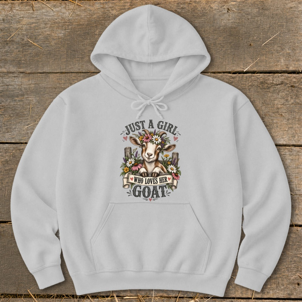 White hoodie with a cartoon goat wearing a flower crown and the text "Just a girl who loves her goat."