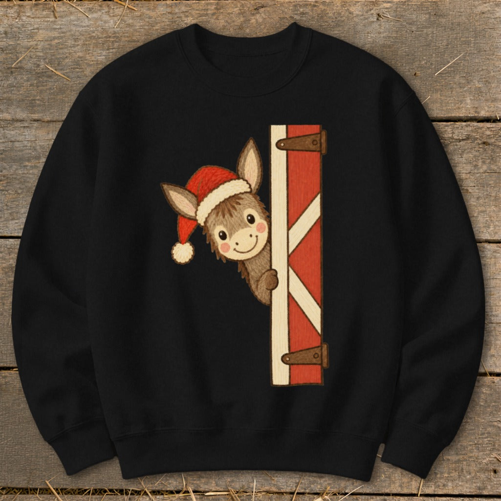 Donkey wearing Santa hat peeking from behind a red barn door graphic.
