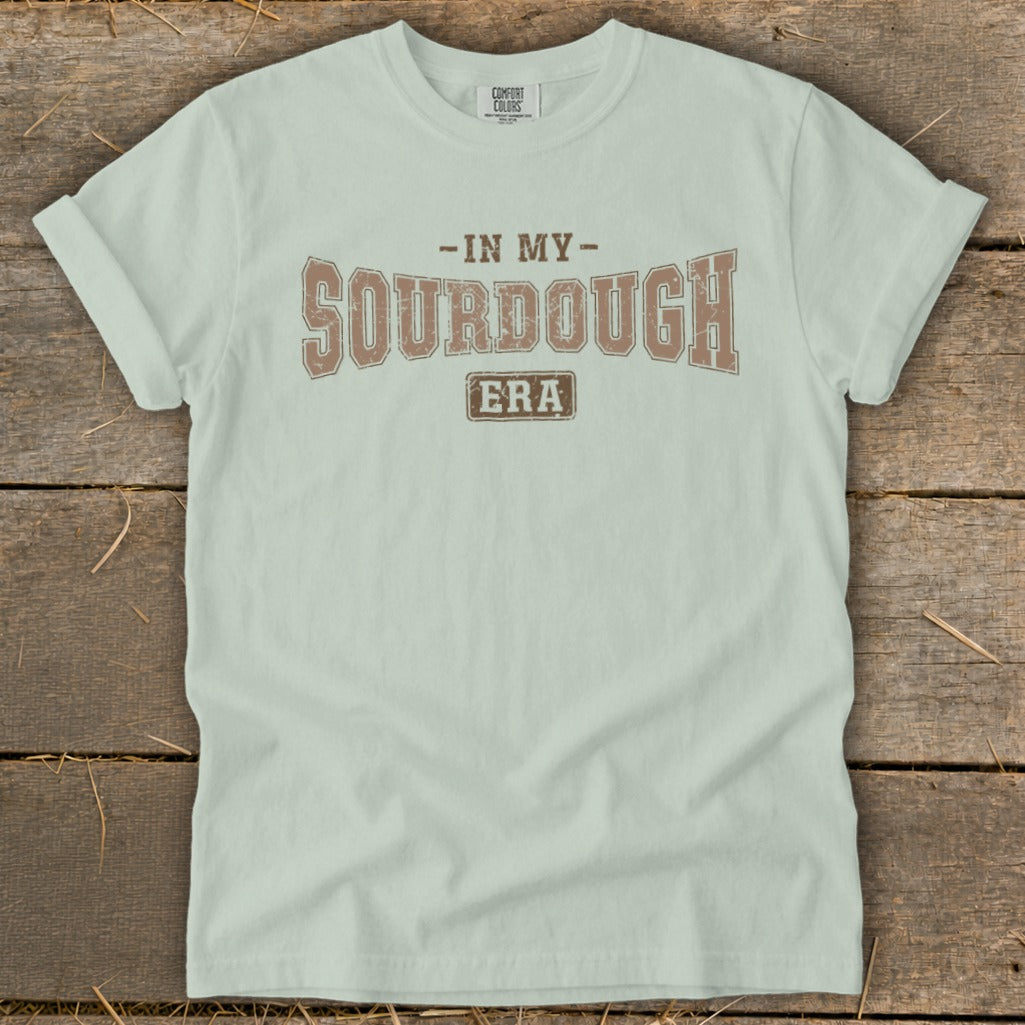 Light green t-shirt with "In My Sourdough Era" printed across the chest.
