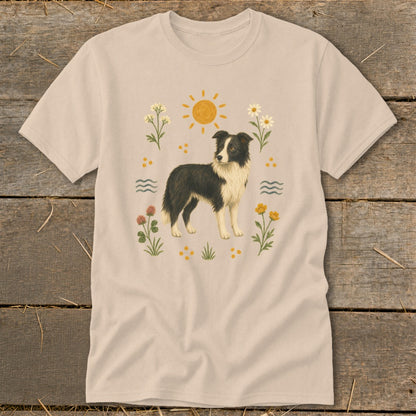 Light beige t-shirt with a Border Collie graphic surrounded by flowers, sun, and water waves.
